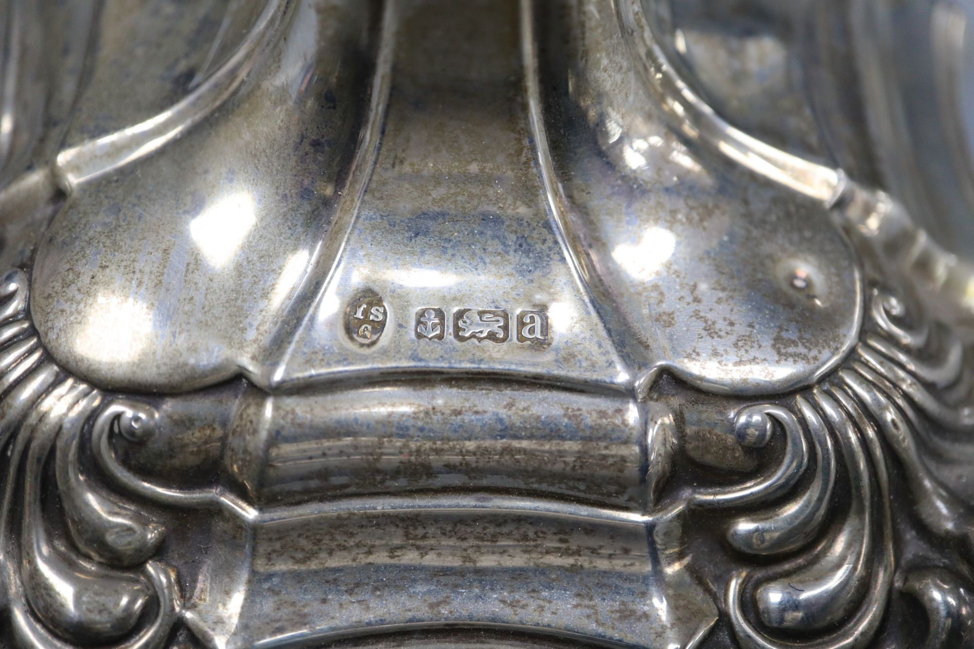 A late Victorian George III style silver candlestick, I.S. Greenburg & Co, Birmingham, 1900, weighted, 23.5cm.
